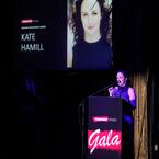 Kate Hamill at podium with Gala logo in background